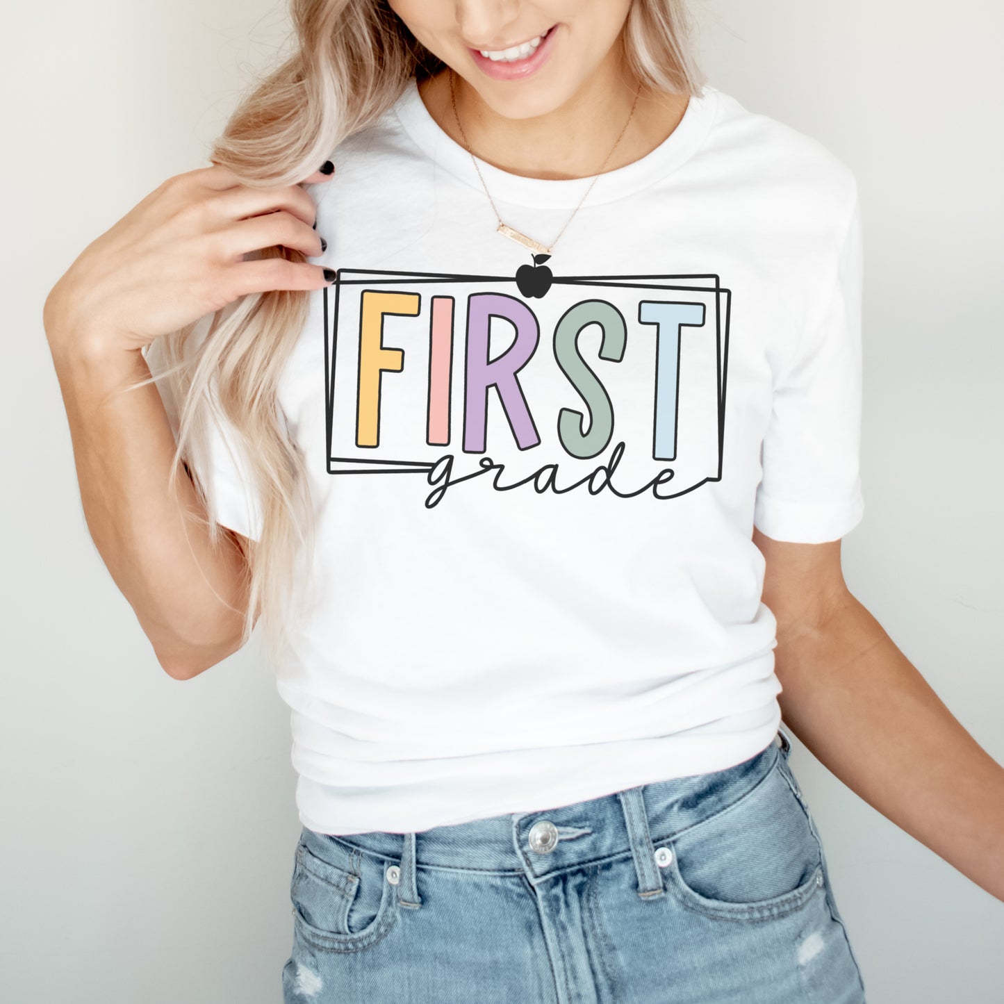 First Grade Teacher Multi Color Apple and Border Tshirt White