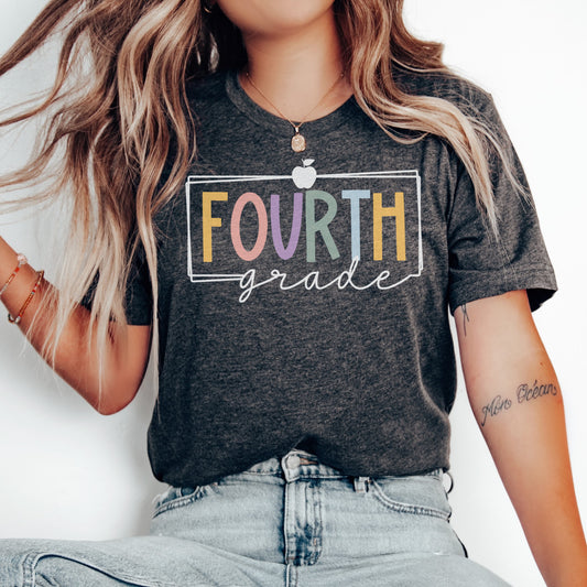 Fourth Grade Teacher Shirt Multicolor Font with apple and white border dark grey heather color