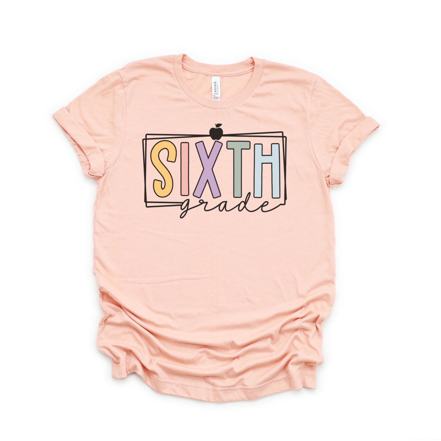 sixth grade teacher shirt multicolored vibrant font with black rectangle borders and apple heather peach color