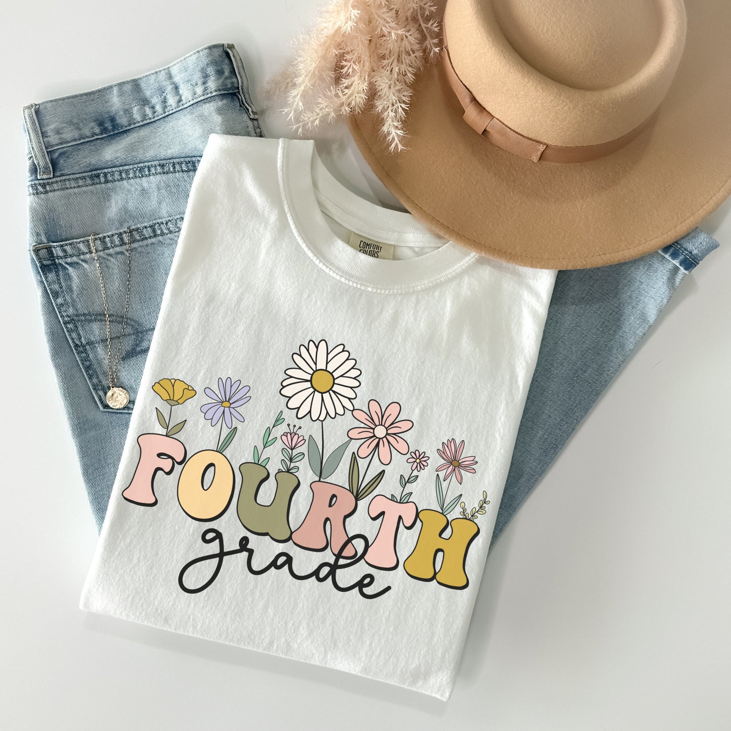 Comfort Colors® "Fourth Grade" Teacher Tshirt, Mulitcolored font with wildflowers | 1717 Unisex Color: White